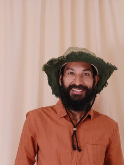 Model wearing a green-cruiser-string-hat-front view, Hand-made in Nepal